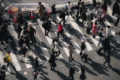 High angle view of people walking on street