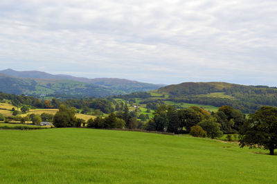 Scenic view of landscape against cloudy sky