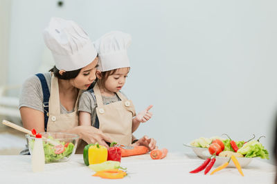 Rear view of mother and daughter