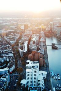 High angle view of city buildings during sunset