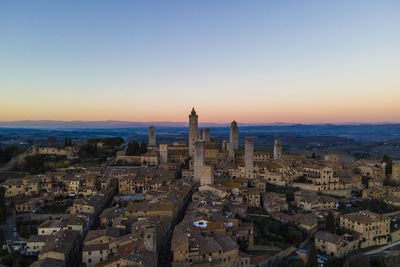 Aerial view of san gimignano, a small old town with medieval tower at sunset, siena, tuscany, italy.