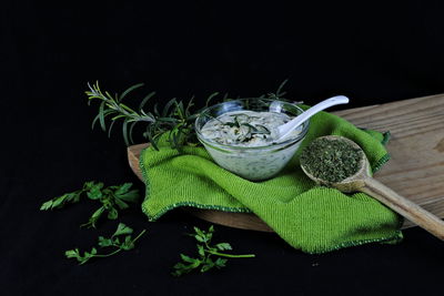 Close-up of vegetables on table against black background