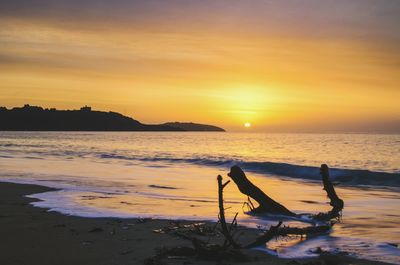 Scenic view of sea against sky during sunset