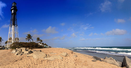 View of beach against cloudy sky