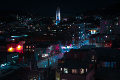 High angle view of illuminated buildings in city at night