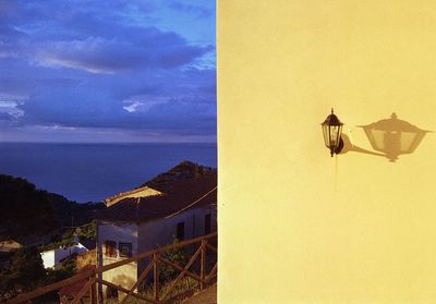 Scenic view of sea and buildings against sky