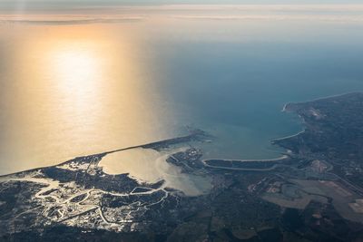 High angle view of sea shore against sky