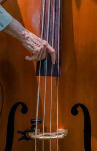 Cropped hand playing cello