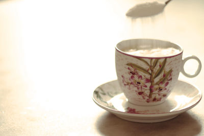 Close-up of coffee cup on table