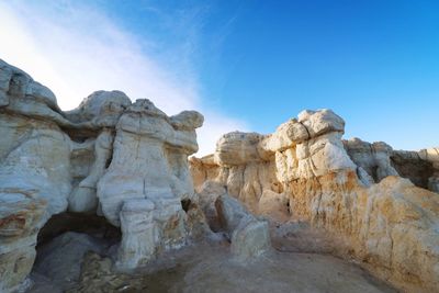 Low angle view of rock formation against sky