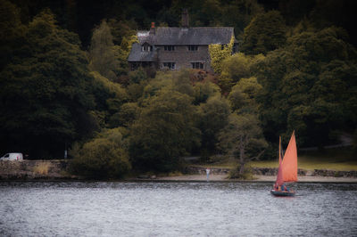 Scenic view of lake by building