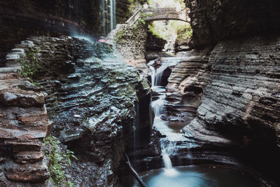 Water flowing through rocks in forest