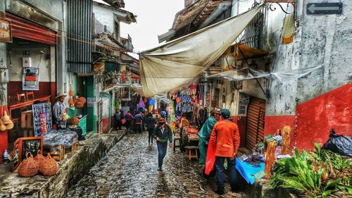 People at market during monsoon