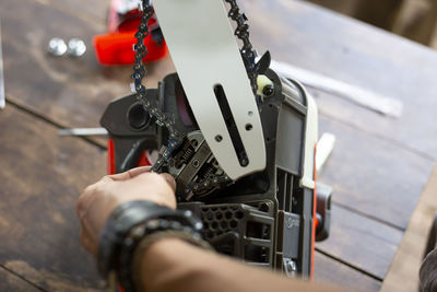 Cropped image of man repairing car