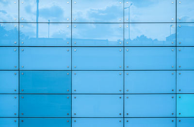 Full frame shot of blue glass building