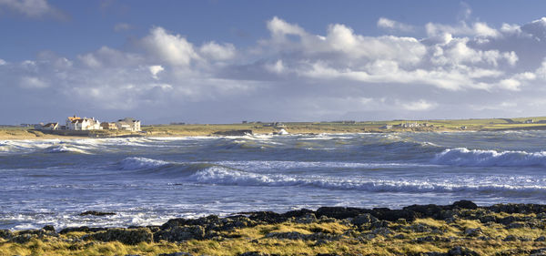 Scenic view of beach against sky