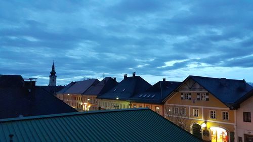 City buildings against cloudy sky