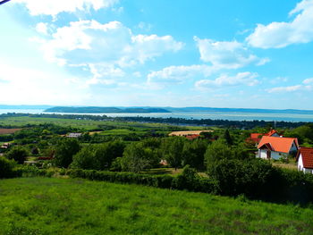 Scenic view of landscape against cloudy sky