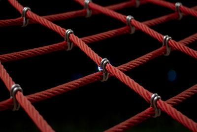 Ropes in the playground. climbing net, shot close-up. ropes fastened with links.