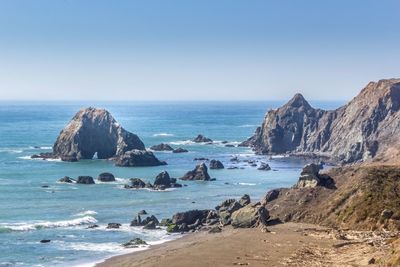 Scenic view of sea against clear blue sky