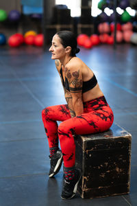 Side view of young woman exercising in gym