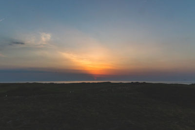 Scenic view of silhouette landscape against sky during sunset