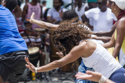 Rear view of people enjoying at market