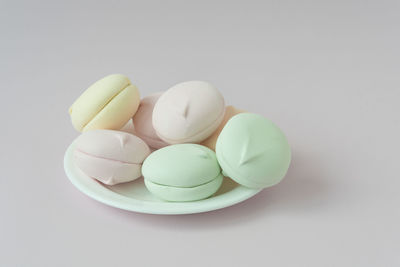 Close-up of candies against white background