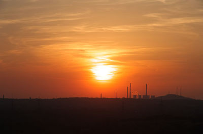 Scenic view of silhouette landscape against sky during sunset