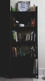 Stack of books on shelf at home