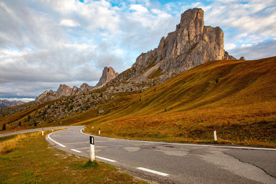 View of road at mountains against sky