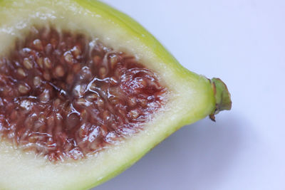 Close-up of lemon slice against white background