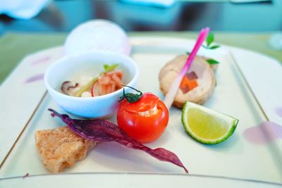 Close-up of fruits served in plate on table