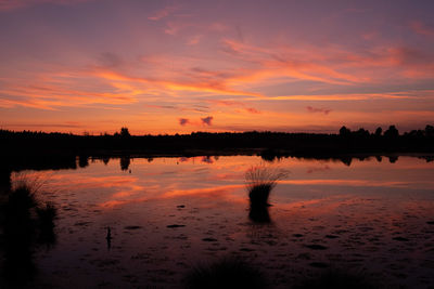 Scenic view of beach against sky during sunset