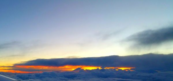 Low angle view of cloudy sky at sunset