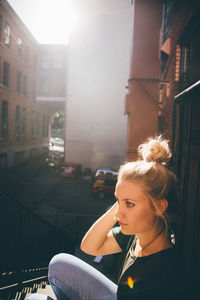 High angle view of woman sitting on steps