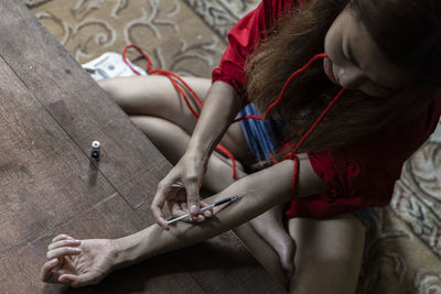 High angle view of woman holding hands