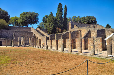 Ruins of building against blue sky