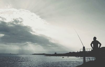 Man fishing in sea