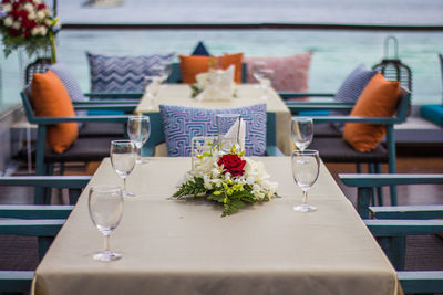 Flower vase on table in restaurant