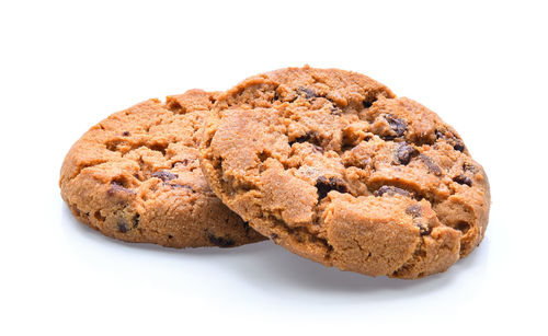 Close-up of cookies against white background