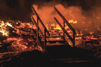 High angle view of fire against sky at night