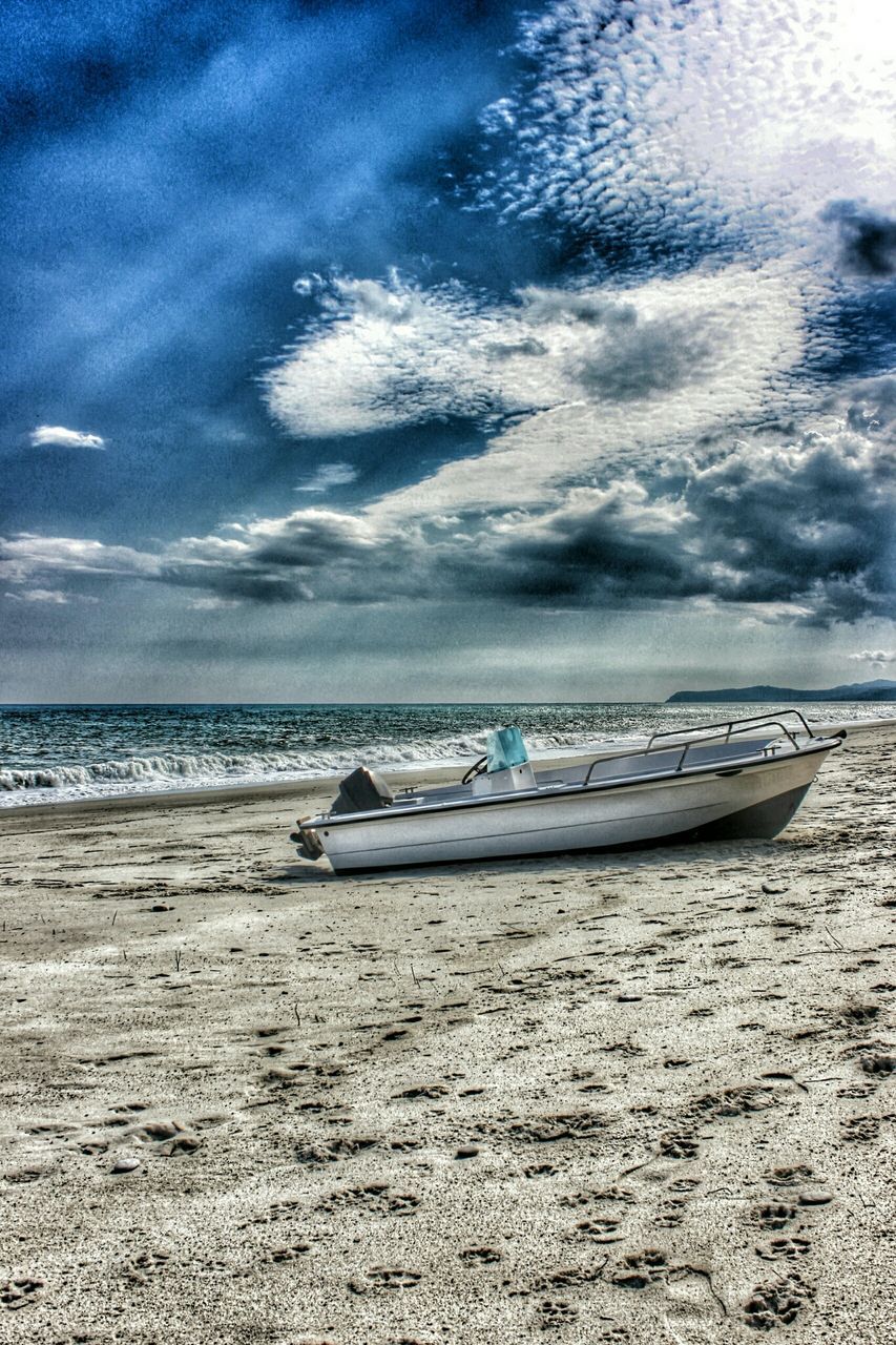 sea, sky, horizon over water, beach, transportation, nautical vessel, water, mode of transport, boat, cloud - sky, shore, sand, tranquility, cloudy, tranquil scene, scenics, beauty in nature, nature, cloud, moored
