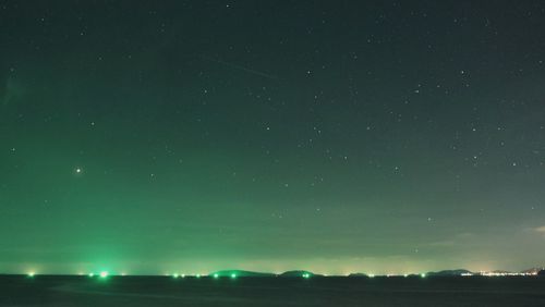 Scenic view of star field against sky at night