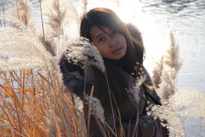 Portrait of smiling young woman during winter