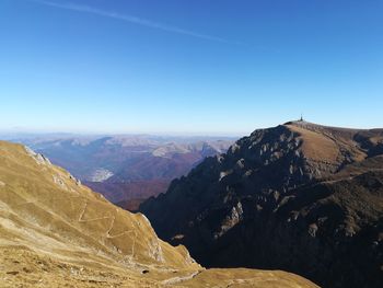 Scenic view of mountains against clear blue sky