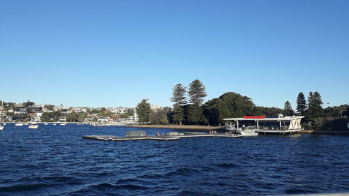 Scenic view of sea against clear blue sky