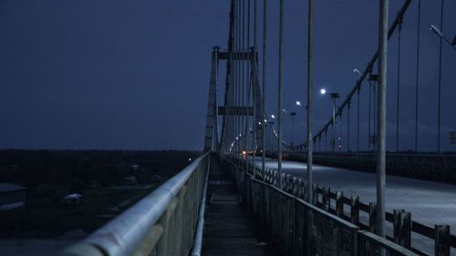 Bridge against sky at night