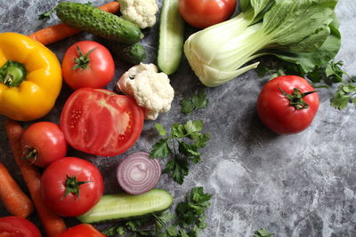 High angle view of tomatoes and fruits on vegetables