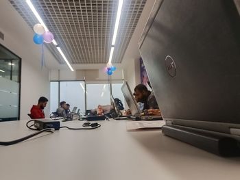 People sitting in illuminated room